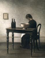 Vilhelm Hammershoi - Young woman sitting behind a table